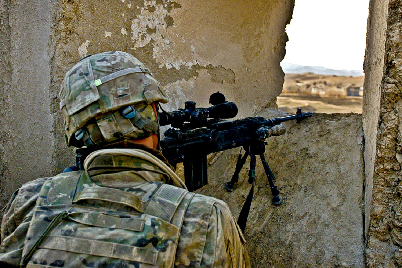 LOGAR PROVINCE, Afghanistan. U.S. Army Pvt. Nicholas C. Berman of Asbury, N.J., an infantryman assigned to Company D, 2nd Battalion, 30th Infantry Regiment, 4th Brigade Combat Team, 10th Mountain Division, Task Force Storm, provides security from a concealed position for Afghan National Security Forces in Kharwar District Jan. 10. Soldiers of Co. D and ANSF recovered two caches and detained four people during the two-day operation. (Photo by U.S. Army Sgt. Cooper T. Cash, Task Force Patriot Public Affairs). Flickr - The U.S. Army.
