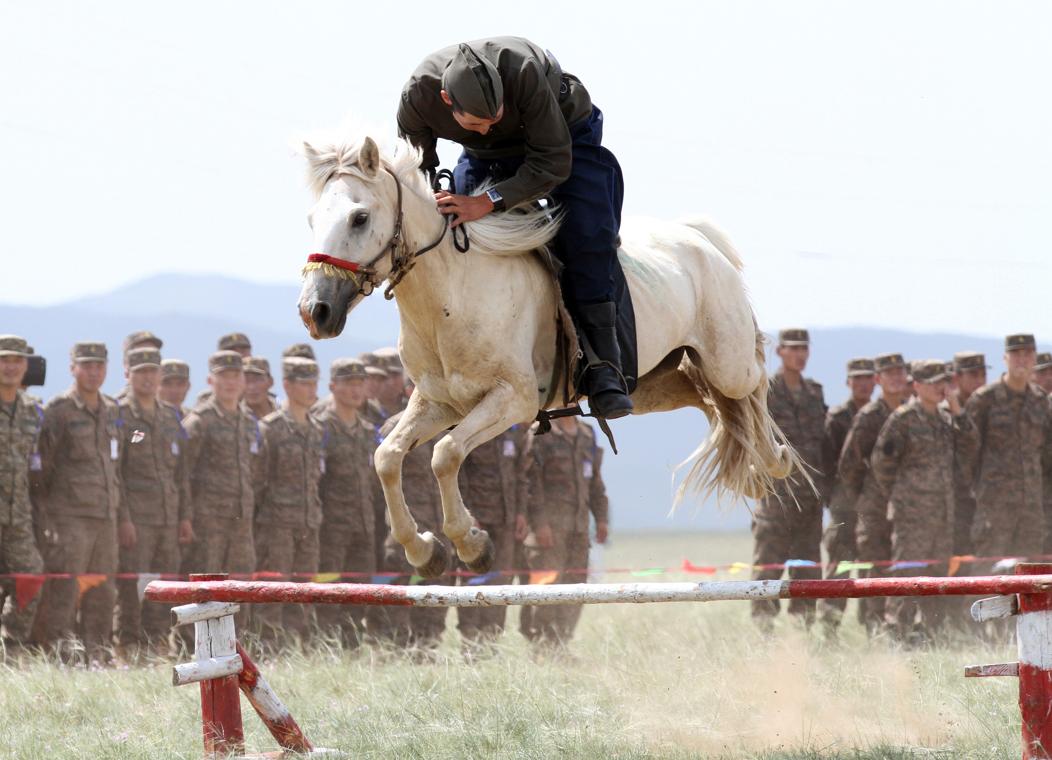 A Member of the Mongolian Armed Forces 234 Cavalry Unit, jumps his horse during the opening ceremony of Exercise Khaan Quest in Five Hills Training Area, Mongolia. Flickr - DVIDSHUB
